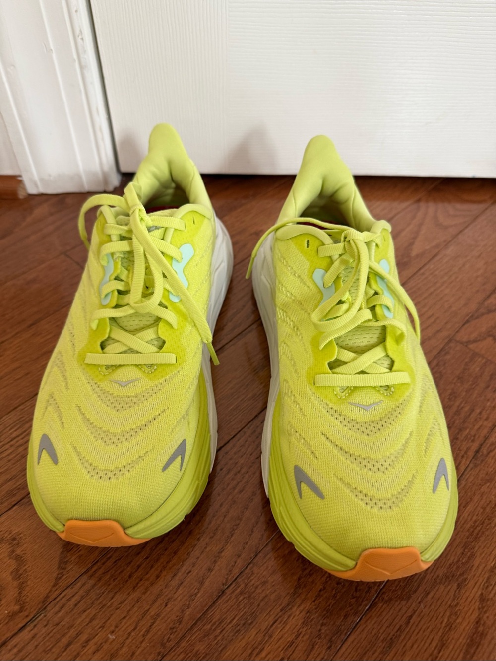 Women’s Hoka Arahi 6 Neon Yellow Athletic Running Shoes with Orange Accents